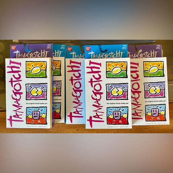 5 Vintage Tamagotchis;gold,green, white,yellow/black,blue/pink-unopened in boxes - Picture 1 of 6